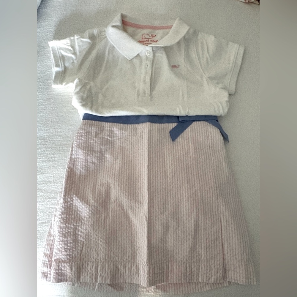 Vineyard Vines girl’s pink seersucker skirt and coordinating white polo shirt